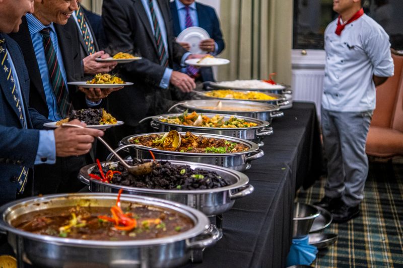 Hangry Joe's community tasting event with guests enjoying hot chicken dishes